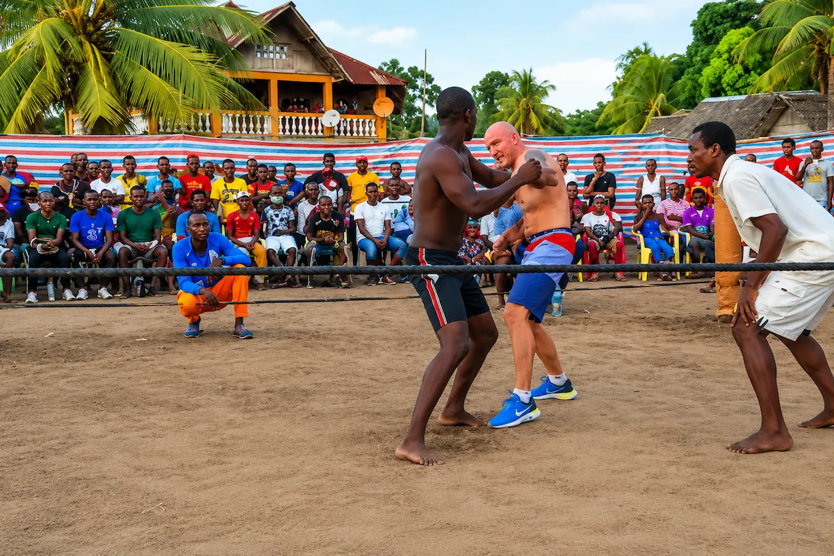Moraingy fighters in standing clinch during traditional Malagasy boxing match