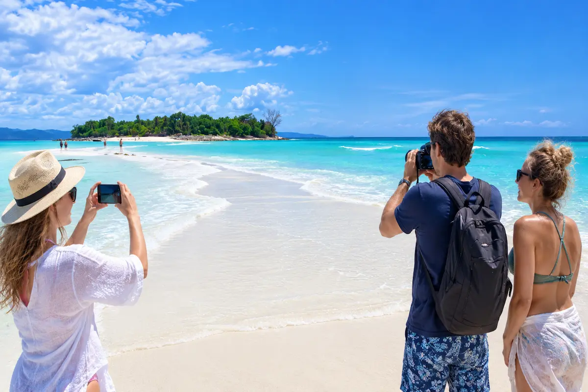 Tourists Taking Photos on Nosy Iranja Sandbank near Nosy Be