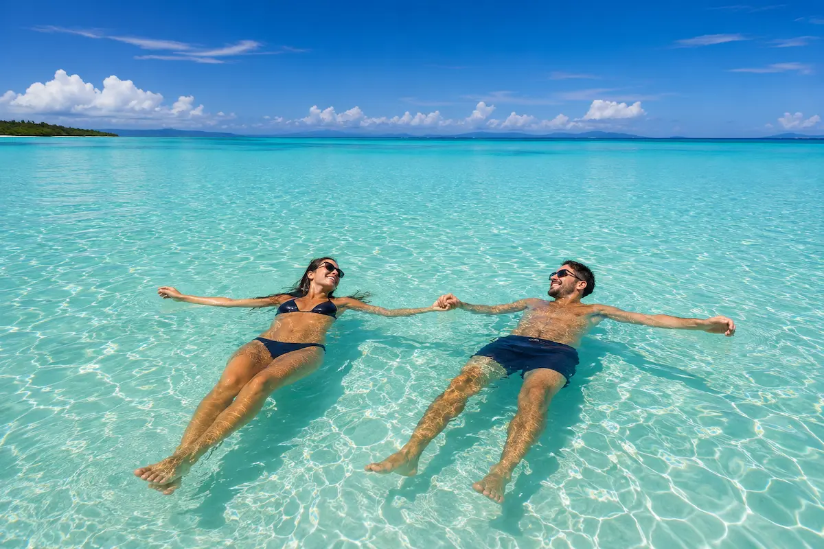 Tourists swimming at Nosy Iranja Beach, Madagascar