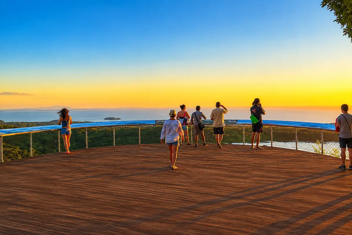 Tourists enjoying sunset at Mont Passot viewpoint Madagascar