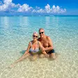 Couple relaxing Nosy Iranja crystal clear water