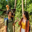 Tourists enjoying a lemur encounter wildlife experience on Nosy Komba