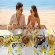 Couple eating beach lunch at Lokobe in Nosy Be Madagascar