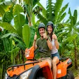 Foreign couple on ATV tour through banana plantation in Nosy Be Madagascar