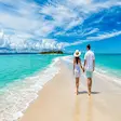 Couple walking on Nosy Iranja sandbank tropical beach during Nosy Be tour