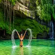 Swimming in rainforest waterfall in Madagascar