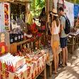 Tourists shopping for handmade crafts in Nosy Komba village, Madagascar