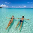Tourists swimming at Nosy Iranja Beach, Madagascar