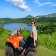 Tourist interacting with a ring-tailed lemur at Lemuria Land Park in Madagascar