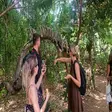 Tourist feeding King Julien lemur at Lemuria Land