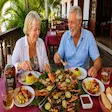 Tourists eating fresh seafood in Nosy Be Madagascar