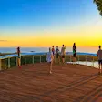 Tourists enjoying sunset at Mont Passot viewpoint Madagascar