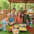 Tourists enjoying a traditional Malagasy lunch during Nosy Be tour in Madagascar