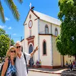 Tourists taking photos at St Peter and St Paul church in Nosy Be Madagascar