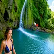 Woman enjoying waterfall in Nosy Be Madagascar