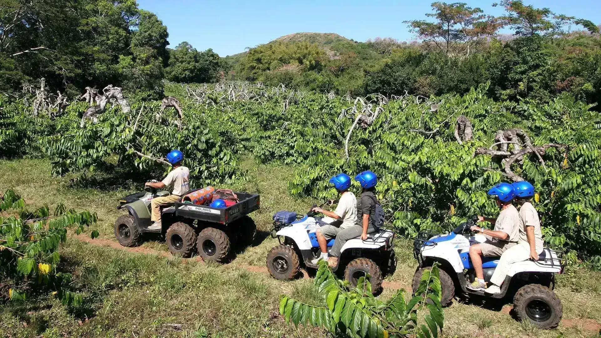 Riding quad bikes along scenic trails in Nosy Be Madagascar